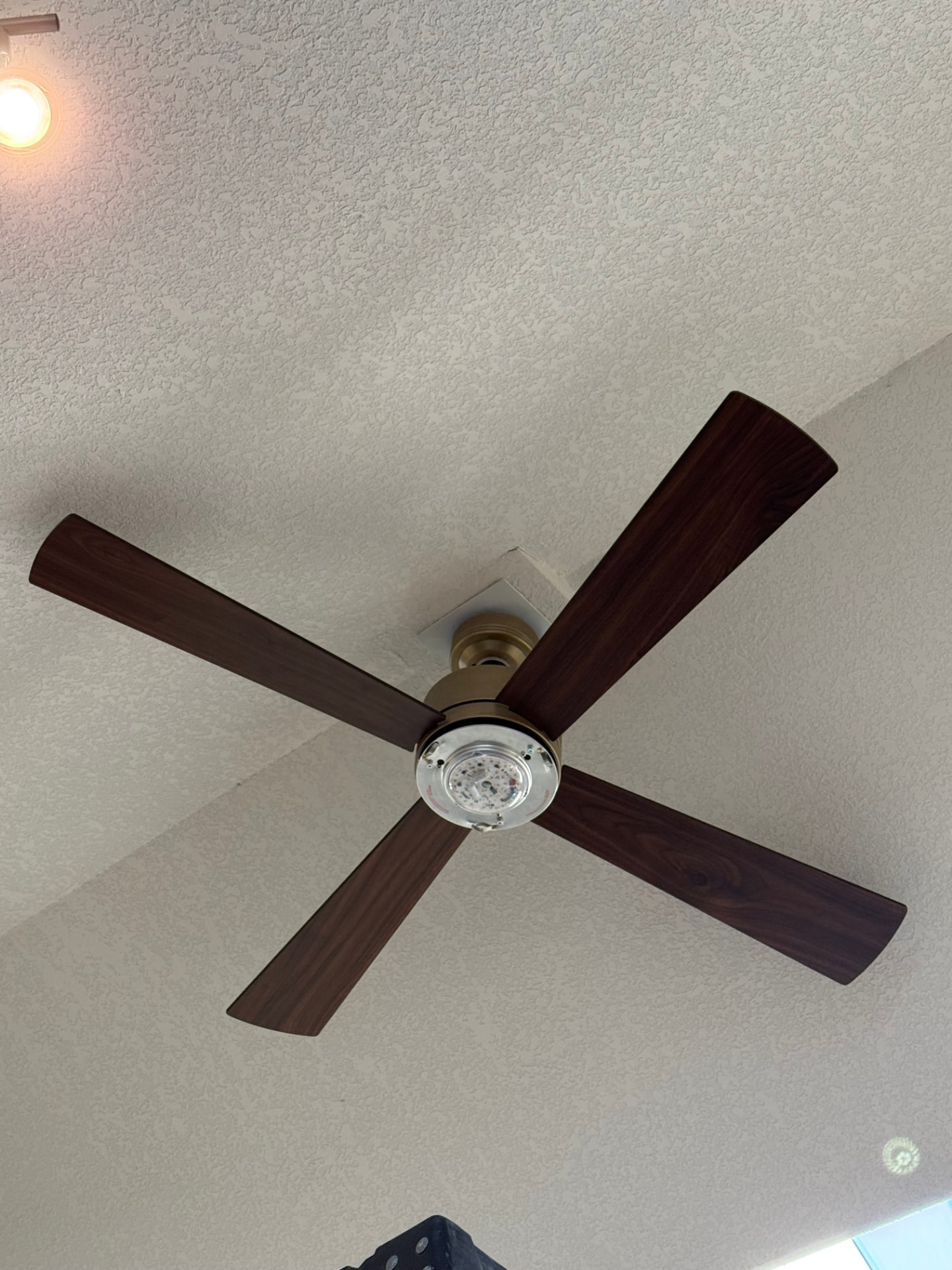 Modern four-blade ceiling fan installation